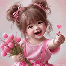 a little girl in a pink dress is holding a bouquet of pink flowers .