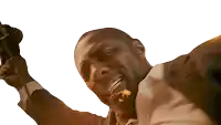 a man in a suit is holding a microphone in his right hand