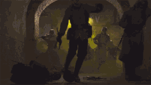 a man in a hat is standing in a dark room with a yellow light