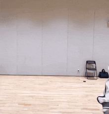 a person giving a thumbs down in a room