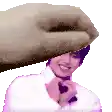 a hand is holding a man 's head in a pixel art style .