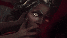 a close up of a man 's face with a red background