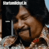 a man with a mustache is making a funny face while wearing a leopard print shirt .