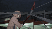 a blurry picture of a girl holding a red object in her hand