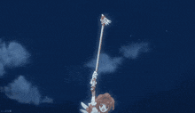 a girl is holding a magic wand in front of a blue background