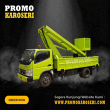 a green truck with a crane on the back is advertising promo karoseri