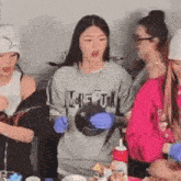 a group of girls are sitting at a table eating food .