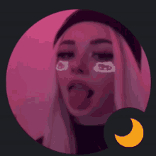 a girl sticking her tongue out with a hello kitty face paint on her face