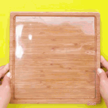 chocolate is being poured onto a wooden cutting board with the words easy plus written on the bottom