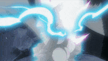 a person 's hand is glowing with a blue light