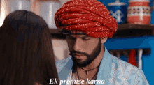 a man wearing a turban is talking to a woman and the words ek promise karna are above him