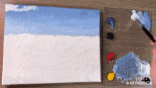 a person is painting on a canvas with the words made in animatica in the lower right corner