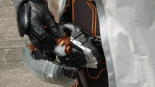 a close up of a person wearing a helmet that says ' x-men ' on it