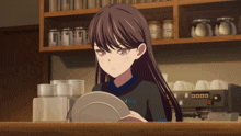 a girl wearing a shirt that says ing holds a plate