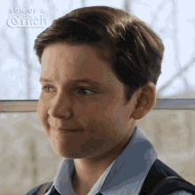 a boy is smiling in a son of a catch ad