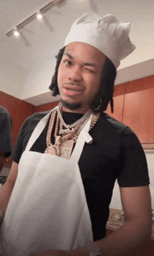 a man wearing a chef 's hat and apron