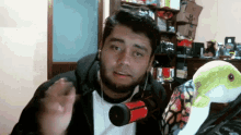 a man with a beard wearing headphones and a microphone