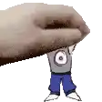 a hand is holding a cartoon character with a gray shirt and blue pants .