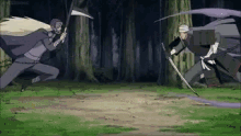 two men are fighting each other with swords in a field .