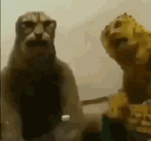 two statues of lions are sitting next to each other .