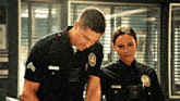 a man and a woman are standing next to each other and the man has a name tag that says ' jackson ' on it