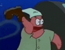 patrick star from spongebob squarepants is wearing a white hat and holding a shoe in his hand .