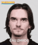 a man with long hair and a beard says cau zmrde on the bottom