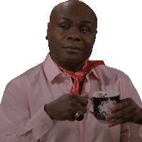 a man wearing a pink shirt and a red bandana is holding a cup of tea