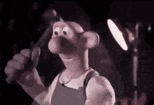 a cartoon character is holding a hammer in his hand in front of a lamp .