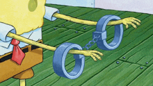 a cartoon of spongebob wearing handcuffs on his hands