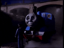 a toy train with the number 11 on the side