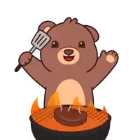 a teddy bear is holding a spatula over a grilled steak