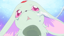 a cartoon character with a spoon in its mouth and a tear coming out of its nose