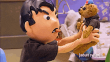 a cartoon character is holding a teddy bear and the words adult swim are on the bottom