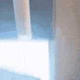 a blurred image of a window with a light shining through it