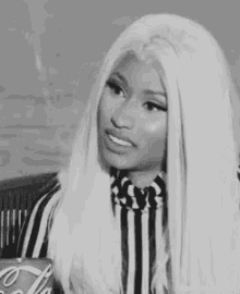 a black and white photo of a woman with long white hair holding a coca cola .