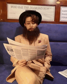 a man with a beard reading a newspaper in front of a sign that says who has the diamond now