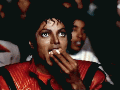 Michael Jackson Watching A Movie And Eating Popcorn GIF - Movie Time Movie Theater GIFs