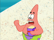 patrick star from spongebob squarepants is eating popcorn on the beach