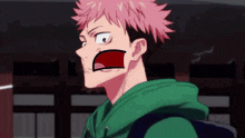 a boy with pink hair and a green hoodie is making a funny face with his mouth open .