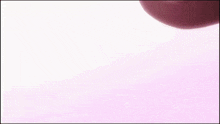 a close up of a person 's feet on a pink surface
