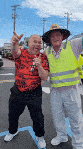 two men are posing for a picture and one of them is wearing a shirt that says ucsd