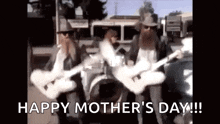 a man with a beard is playing a guitar while another man plays a drum .