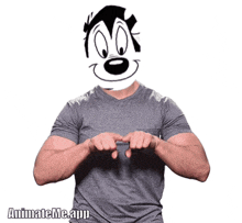 a man wearing a grey shirt has a cartoon character 's face on his shirt