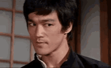 bruce lee frown disapprove no nope