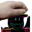 a hand is reaching out towards a colorful robot with a rainbow face .