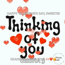 a happy valentine 's day greeting card with hearts and the words `` thinking of you '' .