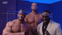 three men are posing for a picture in front of a sign that says all elite wrestling