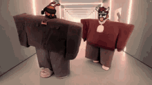 two roblox characters are standing in a hallway