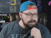 a man wearing glasses and a blue hat has a lvl 74